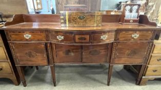 An Irish mahogany and inlaid galleried back sideboard with bow front centre and three drawers and