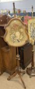 Victorian walnut framed pole screen set with a central floral tapestry panel, 147cm high