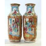 Small pair of Cantonese porcelain vases with typical polychrome designs (chip to rim of one) lot 345