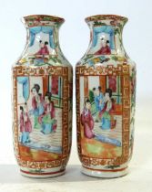 Small pair of Cantonese porcelain vases with typical polychrome designs (chip to rim of one) lot 345