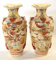 A pair of Satsuma type vases decorated with Japanese figures in a Satsume palette, 24cm high