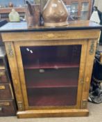 Victorian walnut pier cabinet with single glazed door opening to a fabric lined shelved interior,