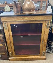 Victorian walnut pier cabinet with single glazed door opening to a fabric lined shelved interior,