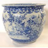 Monumental Japanese porcelain jardiniere with blue and white design of birds amongst foliage, 37cm