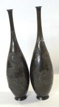 Pair of Japanese bronze vases Meiji period decorated in relief with dragons