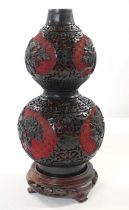 Chinese cinnebar lacquer type vase of double gourd shape finely carved with floral decoration,