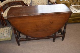 18th Century oak gate leg table raised on turned legs with an oval drop leaf top, 104cm wide