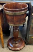 Brass bound hardwood jardiniere stand or wine cooler, set on a base, 77cm high