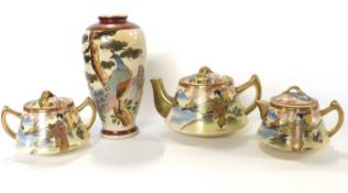 Satsuma teapot, sugar bowl and milk jug together with a Satsuma vase of baluster shape, the vase