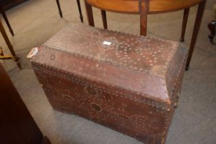 An unusual 19th Century leather mounted and brass studded trunk of sarcophagus form, 80cm wide