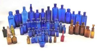 Quantity of blue and brown glass chemists bottles, mainly for poisonous ingredients, many of the