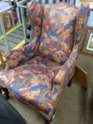 Georgian style wing back armchair with floral upholstery