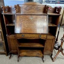 Late 19th century oak bureau bookcase in the Arts & Crafts taste, with central drop down front