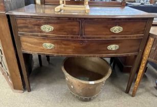 Georgian mahogany three drawer bow front side table with oval brass handles, 120cm wide