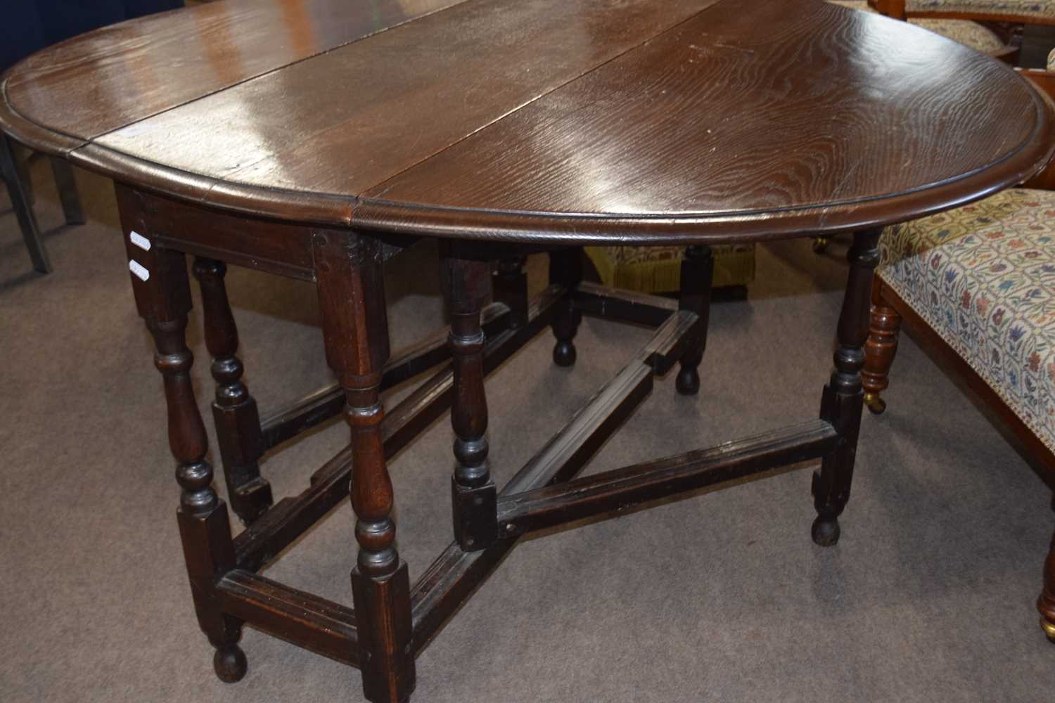 18th Century oak gate leg table raised on turned legs with an oval drop leaf top, 104cm wide - Image 4 of 4