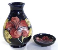 Moorcroft vase of baluster form, the blue ground decorated with hibiscus, together with a further