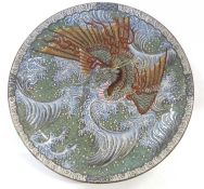 An Oriental pottery charger with polychrome decoration of a dragon amongst the flaming pearl, 40cm