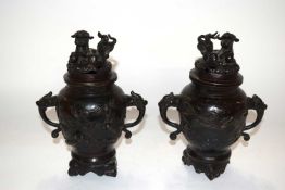 A pair of Chinese or Japanese bronze censers, both with dragon finials, 23cm high
