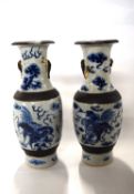 A pair of Chinese porcelain crackle ware vases, late 19th Century decorated with blue and white