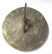 Small patternated brass sun dial with an outer dial with Roman numerals and marked "Sunny Hours",