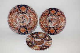 Group of three Japanese porcelain Imari plates, all with typical designs, largest 28cm diameter