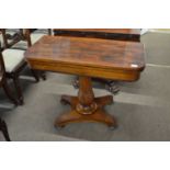 A 19th Century rosewood veneered card table with folding top with a blue baize lined interior over a