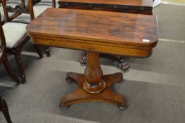 A 19th Century rosewood veneered card table with folding top with a blue baize lined interior over a