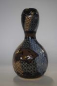A Japanese porcelain vase of double gourd shape, 19th Century, decorated in aesthetic style, 20cm