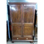 19th century mahogany two-door wardrobe with moulded dentil cornice over two panelled doors and a