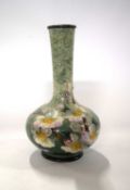 19th Century Lambeth Doulton Impasto ware vase decorated with flowers on a mottled green ground,