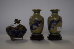 A small pair of Cloisonne vases on wooden stands decorated with dragon chasing the flaming pearl and