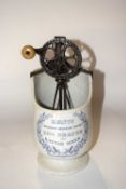 A Kents Improved Monroes Patent Egg Beater and Batter Mixer transfer printed in mauve with garland -