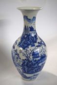 A Chinese porcelain vase, 20th Century with a printed blue and white design on a baluster type body,