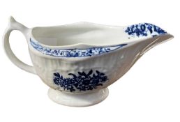 A Lowestoft sauce boat with printed floral design (restored)