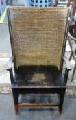 A 19th Century Orkney chair with curved rush back and a stretcher base, 105cm high