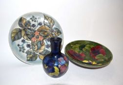 Collection of Moorcroft wares including a small vase in the anemone pattern on blue ground with