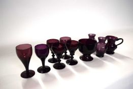 A collection of 19th Century Bristol amethyst coloured glass including six glasses, small bowl and