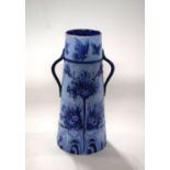 A Moorcroft florian vase, the tapered body with loop handles and typical blue and white florian