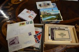 Two small boxes of postcards and other items to include a set of four coloured cards of soldiers