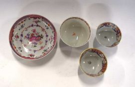 A group of Chinese porcelain wares including a famille rose saucer and three tea bowls, all 18th