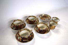 Group of late 18th Century cups and saucers, probably New Hall with a tobacco leaf type design