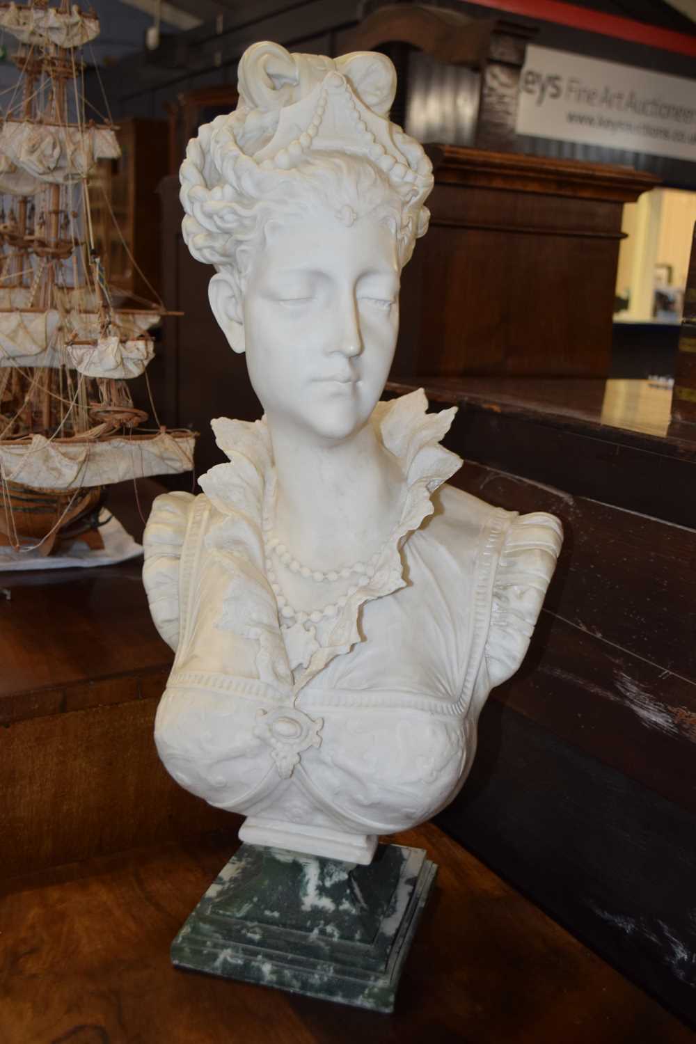 A continental parian style hollow bust Parian bust the pseudo marble effect base marked Parian