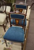 A pair of Edwardian Sheraton Revival side chairs with mahogany frames and inlaid decoration and