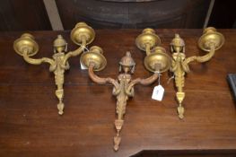 A set of three late 19th or early 20th Century cast gilt metal or ormolu light fittings with urn and