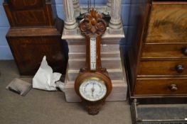 A late Victorian oak cased barometer