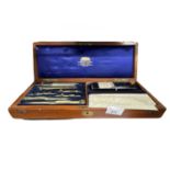 Rectangular mahogany box containing a set of technical drawing instruments made by Harling, Finsbury