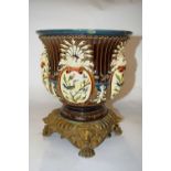 A 19th Century Maiolica style jardiniere, probably French, on metal mask head mounts