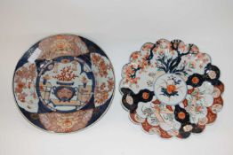 A group of two Japanese porcelain dishes with Imari type designs, 28cm diameter