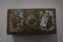 A Cantonese porcelain rectangular box, 19th Century, the famille vert ground with panels of