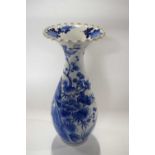 A Japanese porcelain vase decorated with blue and white design of birds amongst branches, 33cm high